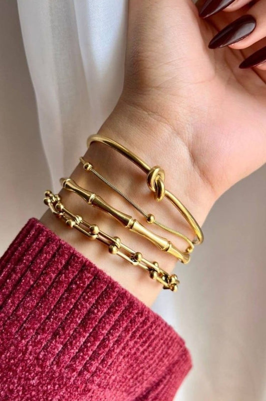 Elegant 4-Piece Gold Bracelet Set for Women - Trendy Stackable Layering Bracelets Including Tie Knot Bangle, Bamboo Textured Cuff, and Link Chain Bracelets, Fashion Jewelry Gift for Her