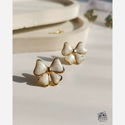 stainless steel earrings, white bow studs, anti tarnish jewelry, gold plated bowknot, hypoallergenic ear studs, coquette aesthetic accessories, enamel ribbon earrings, waterproof gold earrings, cute teen girls gifts, durable minimalist studs
