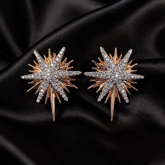 starburst earrings, north star studs, celestial jewelry women, rose gold star earrings, cz crystal statement studs, sunburst earring flare, luxury wedding jewelry, holiday party earrings, oversized star studs, astronomical gifts for her
