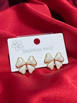 stainless steel earrings, white bow studs, anti tarnish jewelry, gold plated bowknot, hypoallergenic ear studs, coquette aesthetic accessories, enamel ribbon earrings, waterproof gold earrings, cute teen girls gifts, durable minimalist studs